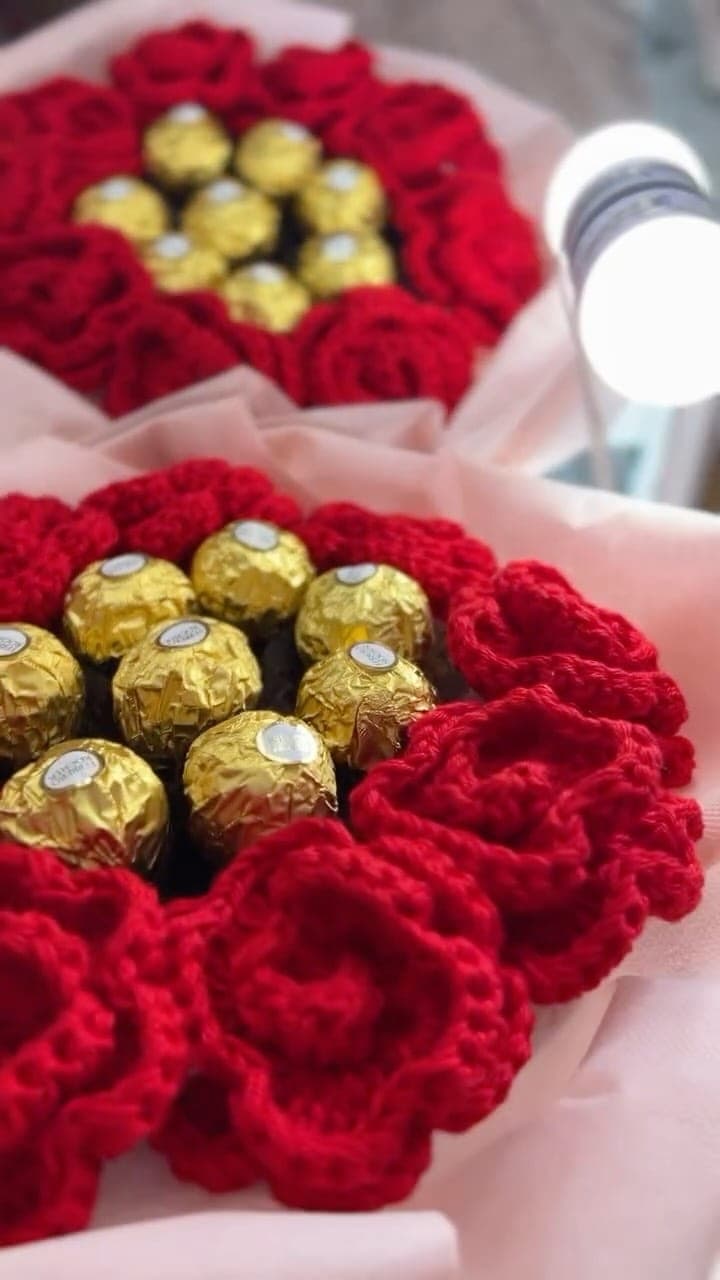 Bouquet of red crochet roses with chocolates