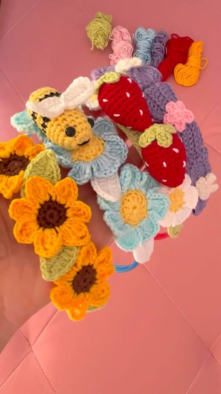 Crochet flowers: sunflowers, daisies, strawberries and a bee